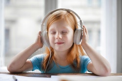 Photo of girl wearing headphones